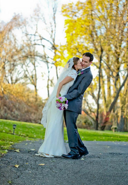 photograph of wedding couple kissing
